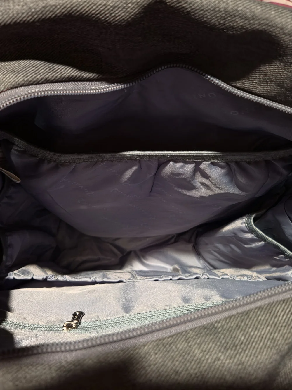 dark gray quilted Ruvalino diaper bag backpack.